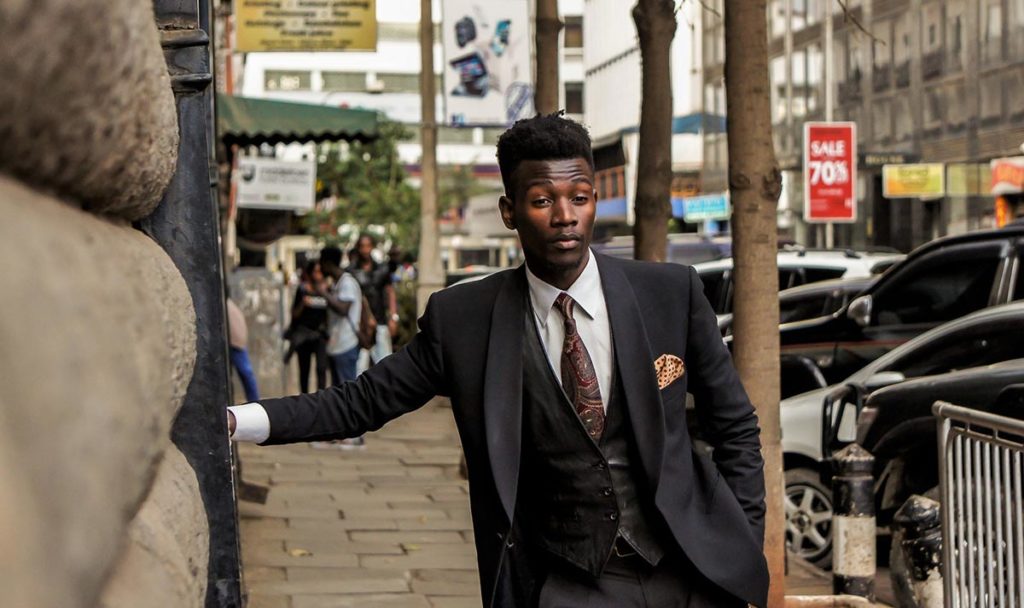 A man looking more formal in a black shawl lapel