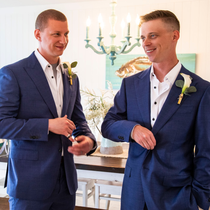 Two men in matching blue suits